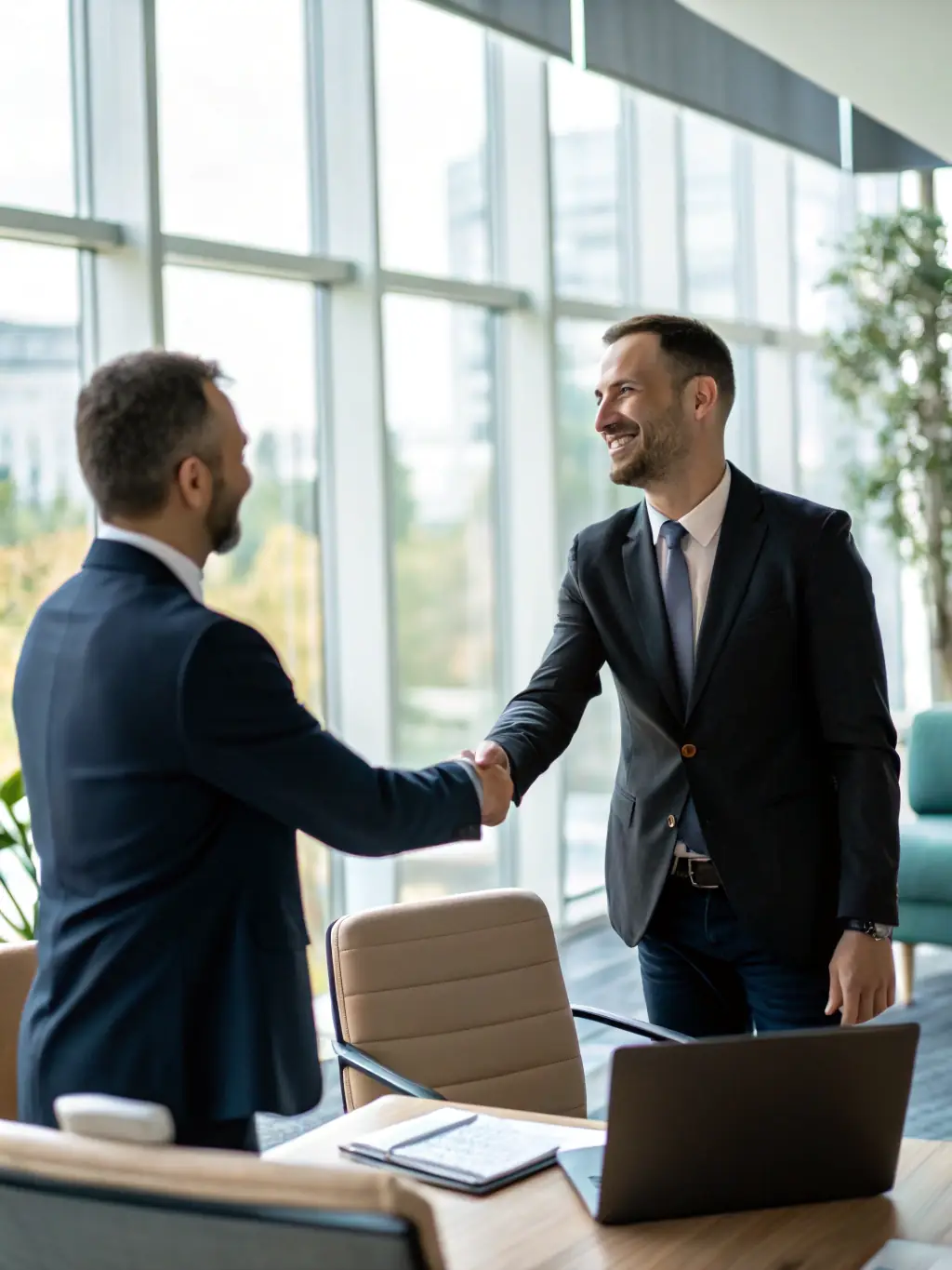 A professional businessman confidently shaking hands with a businesswoman in a modern office setting, symbolizing a successful deal closure facilitated by NextMerge.ai.